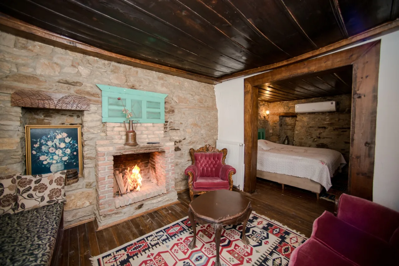 Kemerli Room's stone arch, fireplace and sleeping area